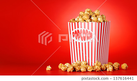 Popcorn bucket on bright red background Popcorn bucket on bright red background 137616441