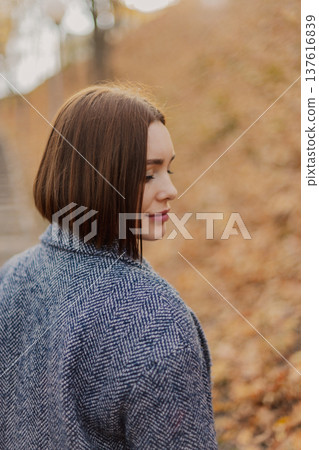 Beautiful young girl posing against the backdrop Beautiful young girl posing against the backdrop 137616839