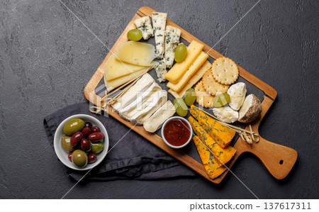 Cheese board with olives grapes and honey Cheese board with olives grapes and honey 137617311