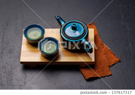 Asian tea ceremony set with teapot and cups Asian tea ceremony set with teapot and cups 137617317