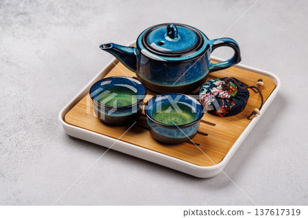 Asian tea ceremony set with teapot and cups Asian tea ceremony set with teapot and cups 137617319