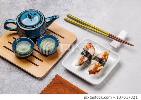 Eel sushi set with tea and teapot Eel sushi set with tea and teapot 137617321