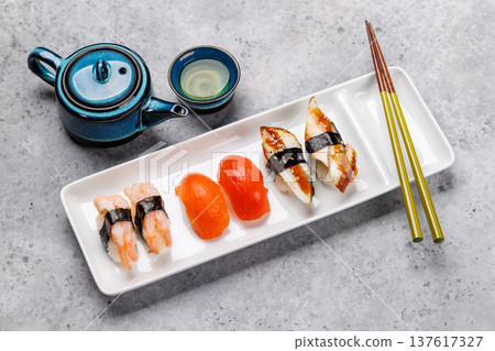 Sushi set with tea and small teapot Sushi set with tea and small teapot 137617327