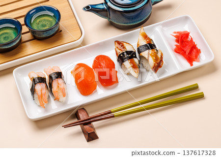 Sushi set with tea and small teapot Sushi set with tea and small teapot 137617328