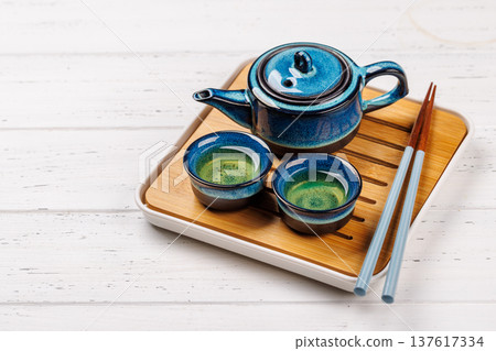 Asian tea ceremony set with teapot and cups Asian tea ceremony set with teapot and cups 137617334