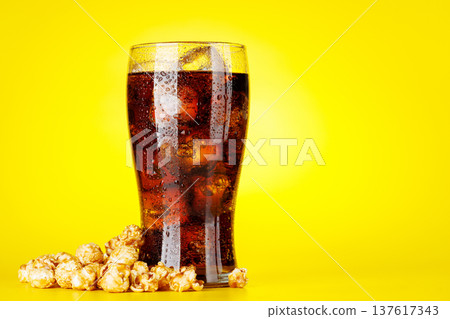 Popcorn and cola on yellow background 137617343