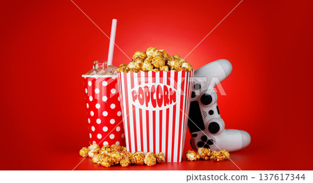 Popcorn, cola and gamepad on red background 137617344