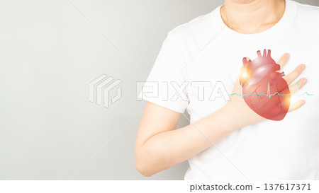 Young female suffering from chest pain and heart organ anatomy with electrocardiogram (ECG) over gray background. Causes of chest pain include palpitation, angina or heart attack. Health care and Young female suffering from chest pain and heart organ anatomy with electrocardiogram (ECG) over gray background. Causes of chest pain include palpitation, angina or heart attack. Health care and 137617371