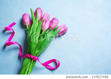Pink tulips bouquet on blue pastel background. Spring Floral Mother's Day Mockup. Pink tulips bouquet on blue pastel background. Spring Floral Mother's Day Mockup. 137617489