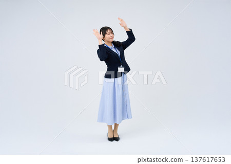 Business woman in a cheering pose Business woman in a cheering pose 137617653