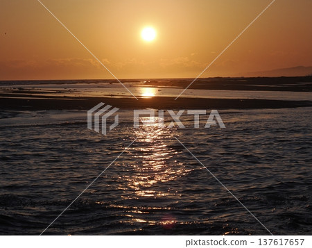 Sunset over Orakumo Beach 137617657