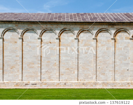 Marble wall of Monumental Cemetery in Pisa, Tuscany, Italy. Marble wall of Monumental Cemetery in Pisa, Tuscany, Italy. 137619122