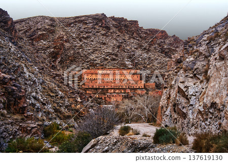 Traditional village kasbah built into rocky atlas mountains Traditional village kasbah built into rocky atlas mountains 137619130
