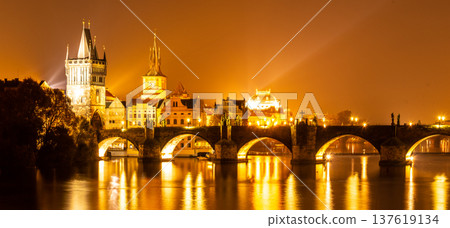 Vltava River and Charles Bridge with Old Town Bridge Tower by night, Prague, Czechia. UNESCO World Heritage Site. Vltava River and Charles Bridge with Old Town Bridge Tower by night, Prague, Czechia. UNESCO World Heritage Site. 137619134