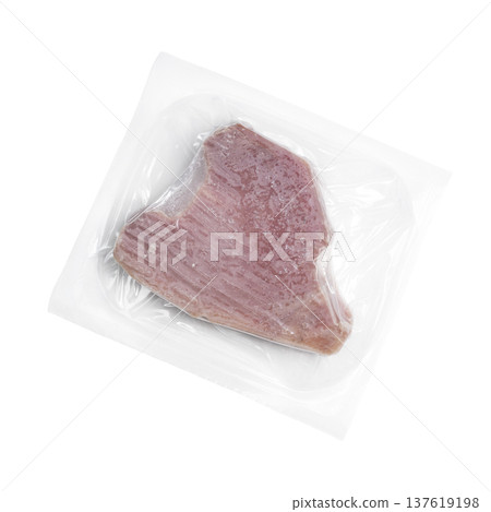 a slice of frozen tuna in a plastic bag a slice of frozen tuna in a plastic bag 137619198