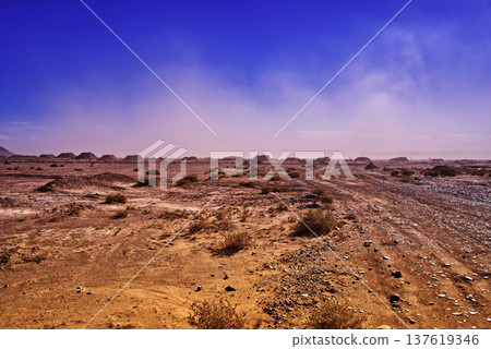 Dirt road in dry moroccan desert landscape Dirt road in dry moroccan desert landscape 137619346
