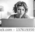 Young woman working on a laptop grayscale image in retro style 137619350