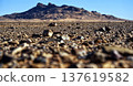Desert rocky landscape under clear blue sky with mountains 137619582