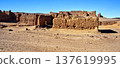 Ancient mud house ruins in desert landscape 137619995