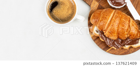 Chocolate croissant with coffee on wooden board breakfast banner 137621409