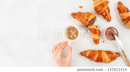Croissants with chocolate spread and espresso breakfast top view Croissants with chocolate spread and espresso breakfast top view 137621414