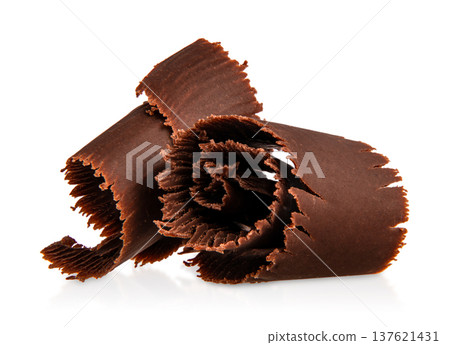 Rolled dark chocolate curls isolated on white background Rolled dark chocolate curls isolated on white background 137621431