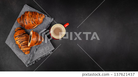 Chocolate croissants with coffee on dark background breakfast flat lay 137621437