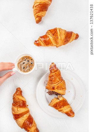Croissants with coffee breakfast composition top view Croissants with coffee breakfast composition top view 137621438