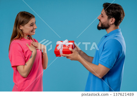 Young man Gives Gift Box To Wife Or Girlfriend. Surprise, Unexpected Present 137621489