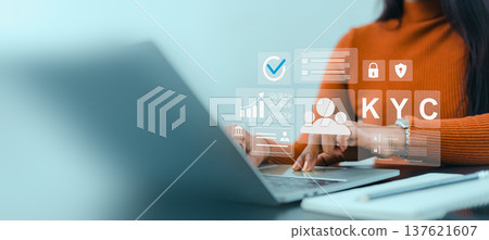KYC digital identity verification process. Cybersecurity and data privacy protection. Remote identity verification for corporate. Businesswoman using laptop for KYC digital identity verification. KYC digital identity verification process. Cybersecurity and data privacy protection. Remote identity verification for corporate. Businesswoman using laptop for KYC digital identity verification. 137621607