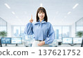 A young woman/businesswoman pointing with her index finger up A young woman/businesswoman pointing with her index finger up 137621752