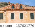 Historical part of city. Rooftop and windows old house. Wooden shutters on windows. Summer in Croatia, Dubrovnik. 137621770