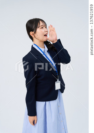 A business woman who poses with her hand on her mouth A business woman who poses with her hand on her mouth 137621959