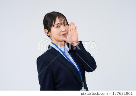 A business woman who poses with her hand on her mouth A business woman who poses with her hand on her mouth 137621961