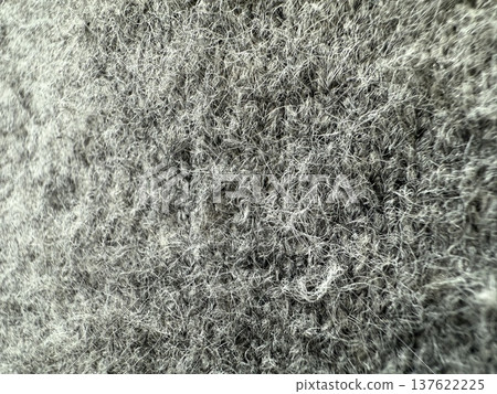 Close-up texture of gray wool fibers in abstract pattern as background image 137622225
