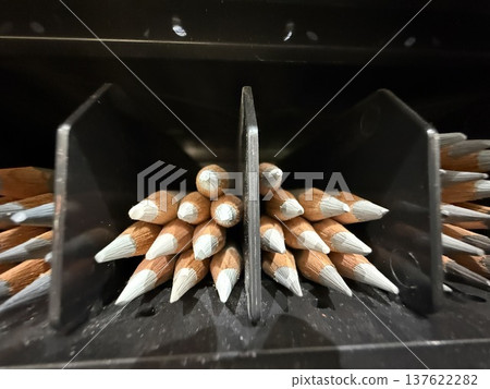 Sharpened pencils neatly arranged in a black tray, ideal for a stationery background Sharpened pencils neatly arranged in a black tray, ideal for a stationery background 137622282