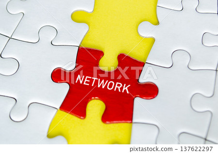 Red network puzzle piece connected vertically with yellow puzzle pieces on a white jigsaw puzzle background Red network puzzle piece connected vertically with yellow puzzle pieces on a white jigsaw puzzle background 137622297