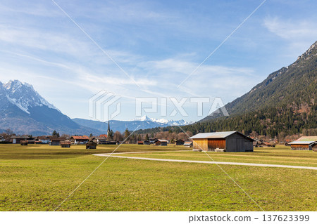 Alpine village with wooden barns and mountain landscape in Garmisch-Partenkirchen, Bavaria, Germany 137623399