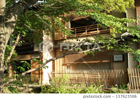 Traditional Japanese architecture surrounded by trees Traditional Japanese architecture surrounded by trees 137623506
