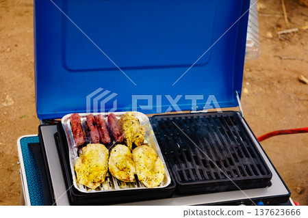 Sausages and chicken meat on grill Sausages and chicken meat on grill 137623666