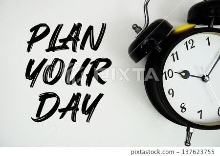 Plan Your Day text with alarm clock flat lay on white background Plan Your Day text with alarm clock flat lay on white background 137623755
