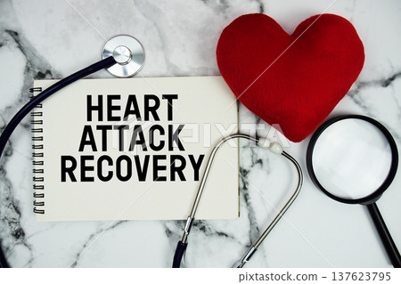 Heart Attack Recovery text written on notepad with red heard and stethoscope on marble background 137623795