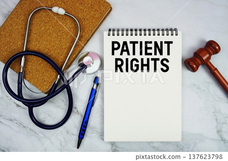Patient Rights text written on notepad with stethoscope and gavel on marble background Patient Rights text written on notepad with stethoscope and gavel on marble background 137623798