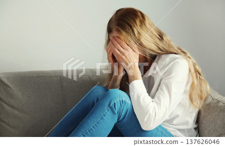 Upset sad crying woman while experiencing mental suffering, depression, fatigue, emotional stress 137626046