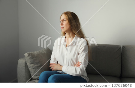 Pensive woman thinks looks out the window, thoughtful girl suffering from depression at home Pensive woman thinks looks out the window, thoughtful girl suffering from depression at home 137626048