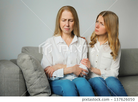 Upset offended caucasian two women, mature mother or sister and adult daughter together at home 137626050