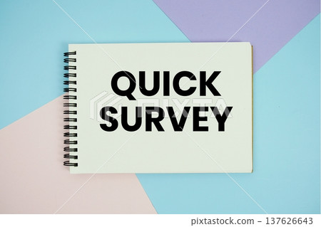 Quick Survey text written on notepad flat lay on multicolor pastel background 137626643