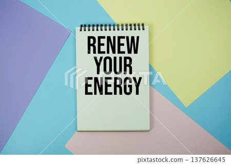 Renew Your Energy text written on notepad flat lay on multicolor pastel background 137626645