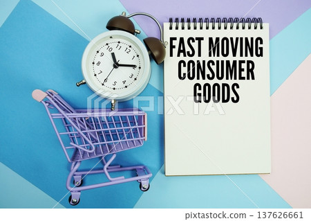FMCG Fast Moving Consumer Goods text written on notepad with alarm clock and trolley shopping cart FMCG Fast Moving Consumer Goods text written on notepad with alarm clock and trolley shopping cart 137626661