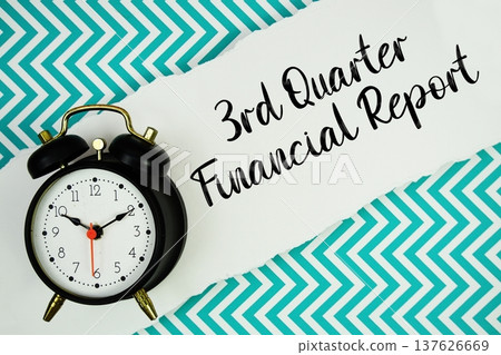 3rd Quarter Financial Report text written on paper rip with alarm clock flat lay on turquoise chevron background 3rd Quarter Financial Report text written on paper rip with alarm clock flat lay on turquoise chevron background 137626669